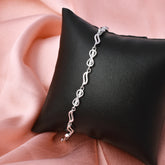 This stylish zircon bracelet by Joy Of Silver is made from 925 sterling silver and features a unique design with sparkling zircon stones. The bracelet is perfect for adding a touch of elegance to any outfit. It's also a great gift for a special occasion.