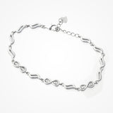This stylish zircon bracelet by Joy Of Silver is made from 925 sterling silver and features a unique design with sparkling zircon stones. The bracelet is perfect for adding a touch of elegance to any outfit. It's also a great gift for a special occasion.